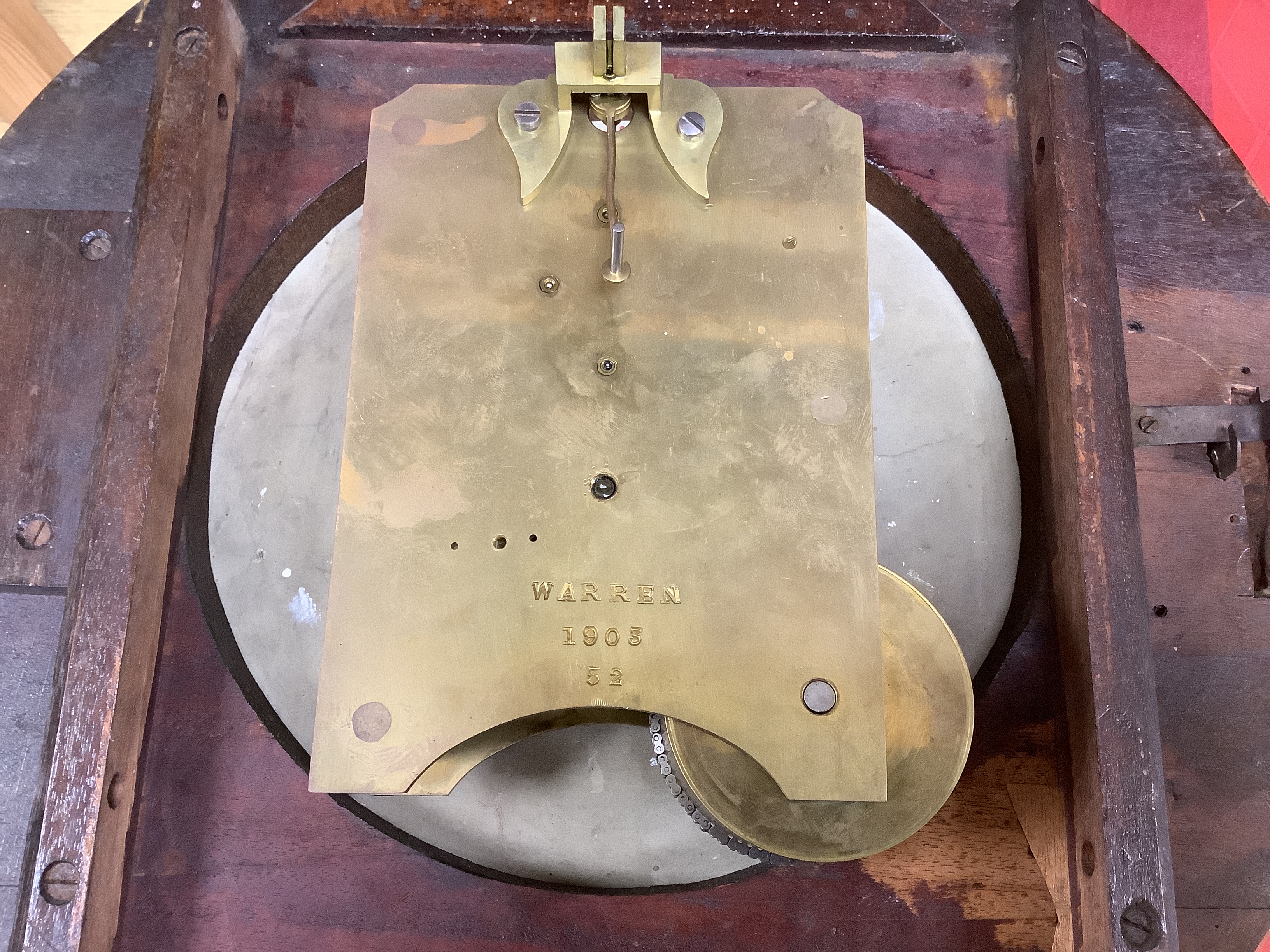 An Edwardian mahogany single fusee wall timepiece, The dial signed Warden Woolwich, the movement stamped Warren 1903/52 and later clock by Ernest N. Gibbs, London (2), largest 46cm diameter